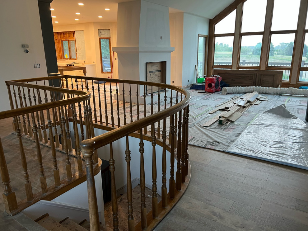 Stain/paint stair railing or replace with iron?