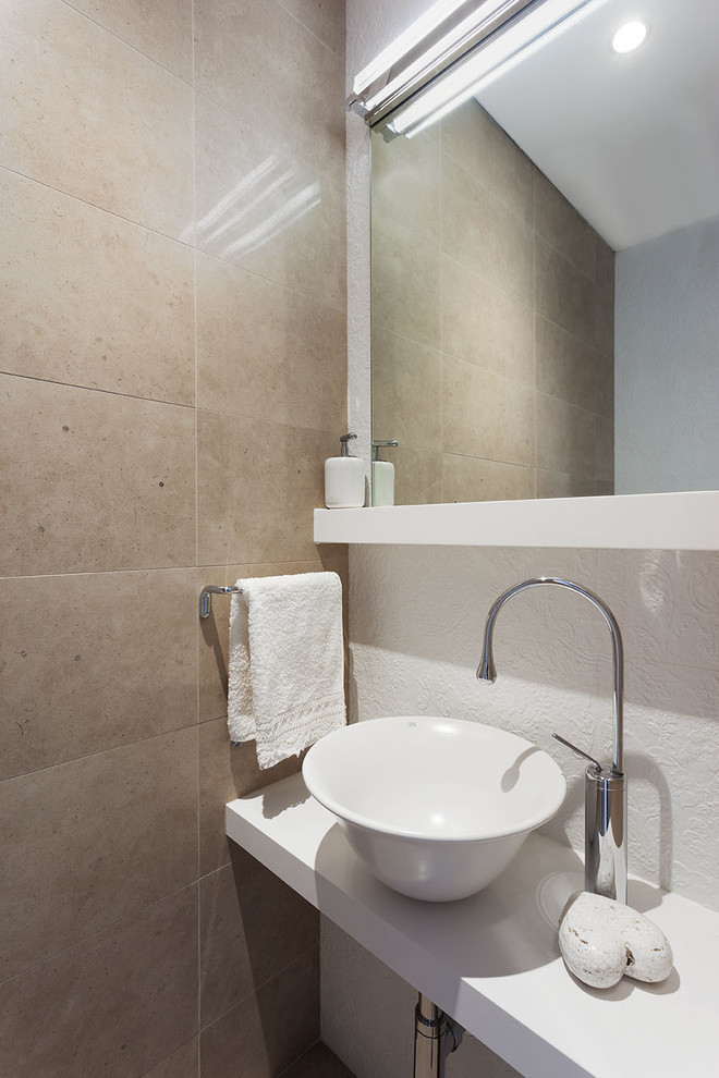 Design ideas for a mid-sized contemporary bathroom in Perth with engineered quartz benchtops and beige tile.