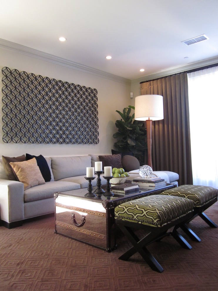 This is an example of a contemporary family room in Los Angeles with carpet.