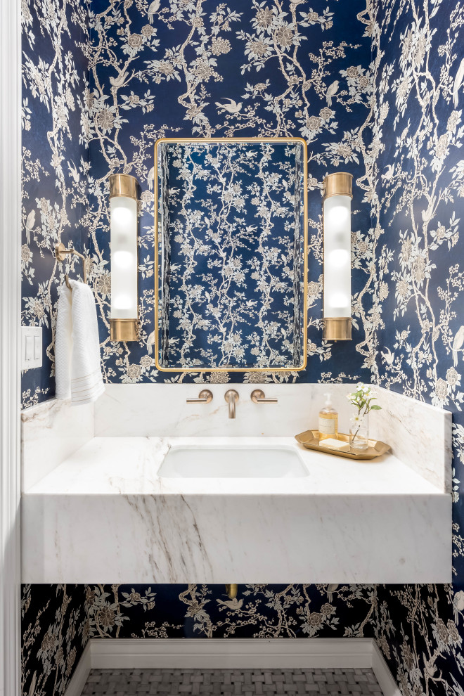 Inspiration for a small powder room in Salt Lake City with white cabinets, porcelain floors, an undermount sink, marble benchtops, multi-coloured floor, white benchtops, a floating vanity and wallpaper.