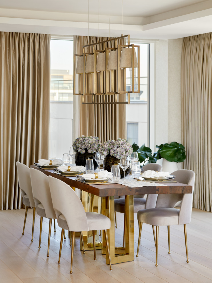 Design ideas for a contemporary dining room in London with light hardwood floors, no fireplace and recessed.
