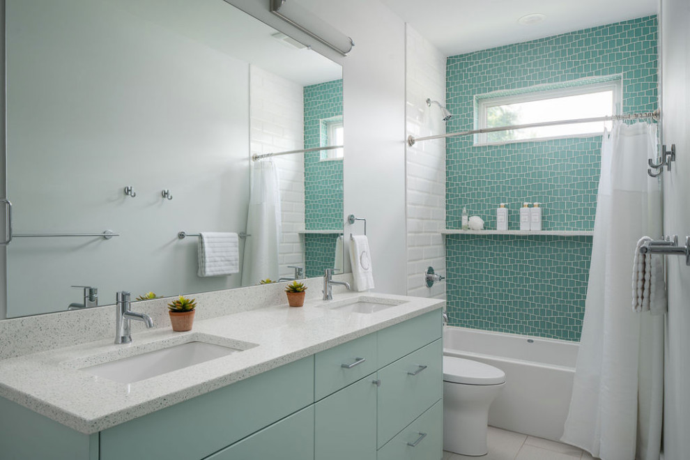 Bathroom - large contemporary kids' white tile and ceramic tile porcelain tile, white floor and double-sink bathroom idea in Columbus with flat-panel cabinets, green cabinets, a two-piece toilet, white walls, an undermount sink, quartz countertops, white countertops and a floating vanity