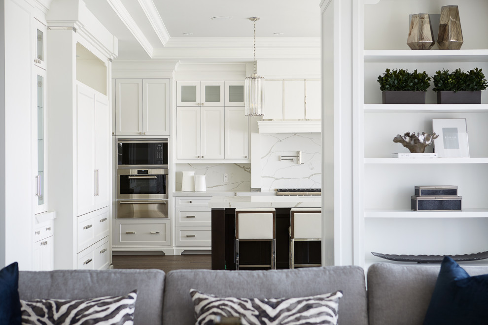 Example of a large transitional eat-in kitchen design in Toronto with recessed-panel cabinets, white cabinets, quartzite countertops, multicolored backsplash, stainless steel appliances, an island and multicolored countertops