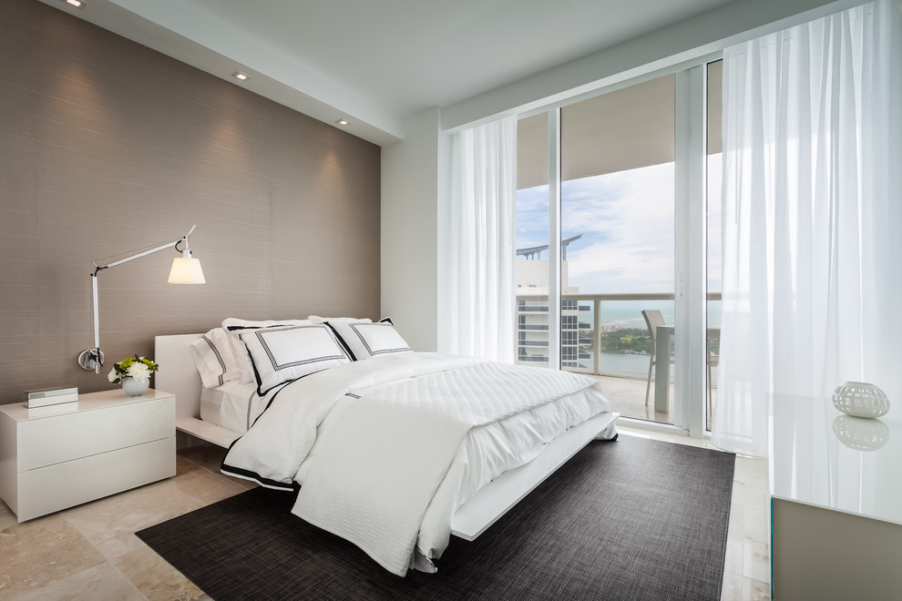 Contemporary bedroom in Miami with grey walls.