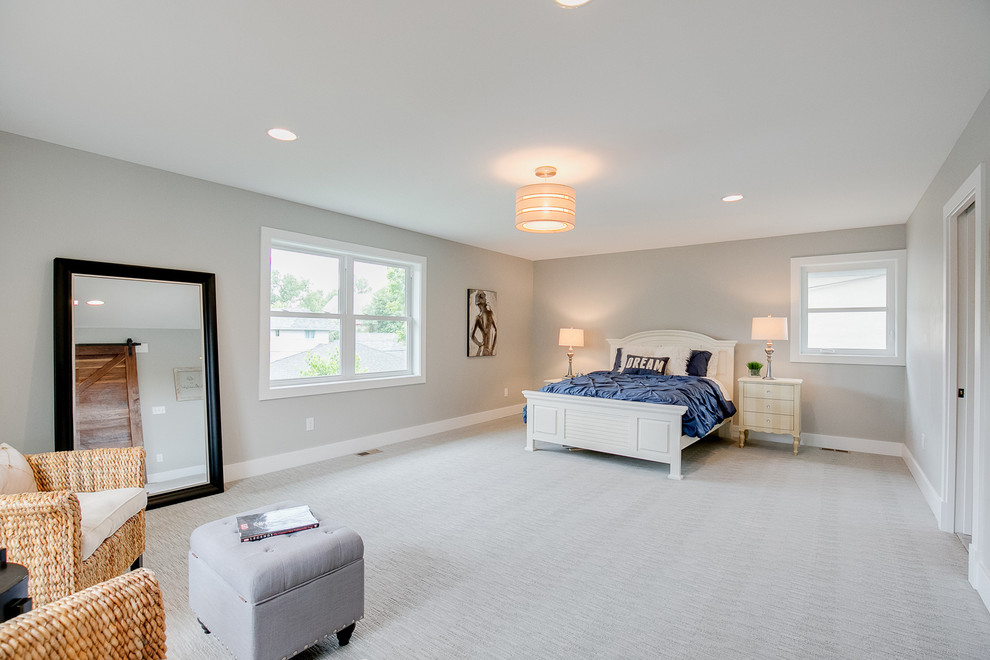 Photo of a large transitional master bedroom in Minneapolis with grey walls, carpet, no fireplace and grey floor.