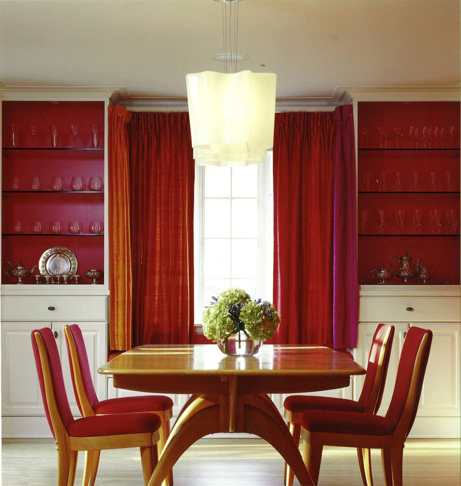 Eclectic dining room in Chicago with light hardwood floors.