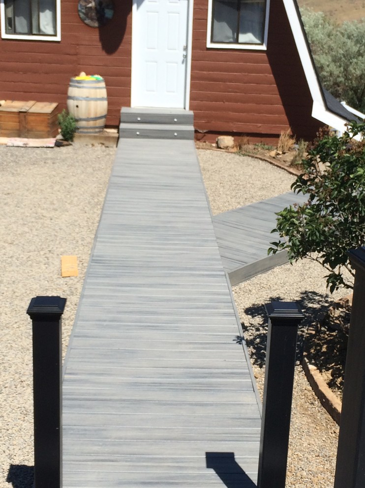 Mid-sized mountain style backyard deck photo with no cover