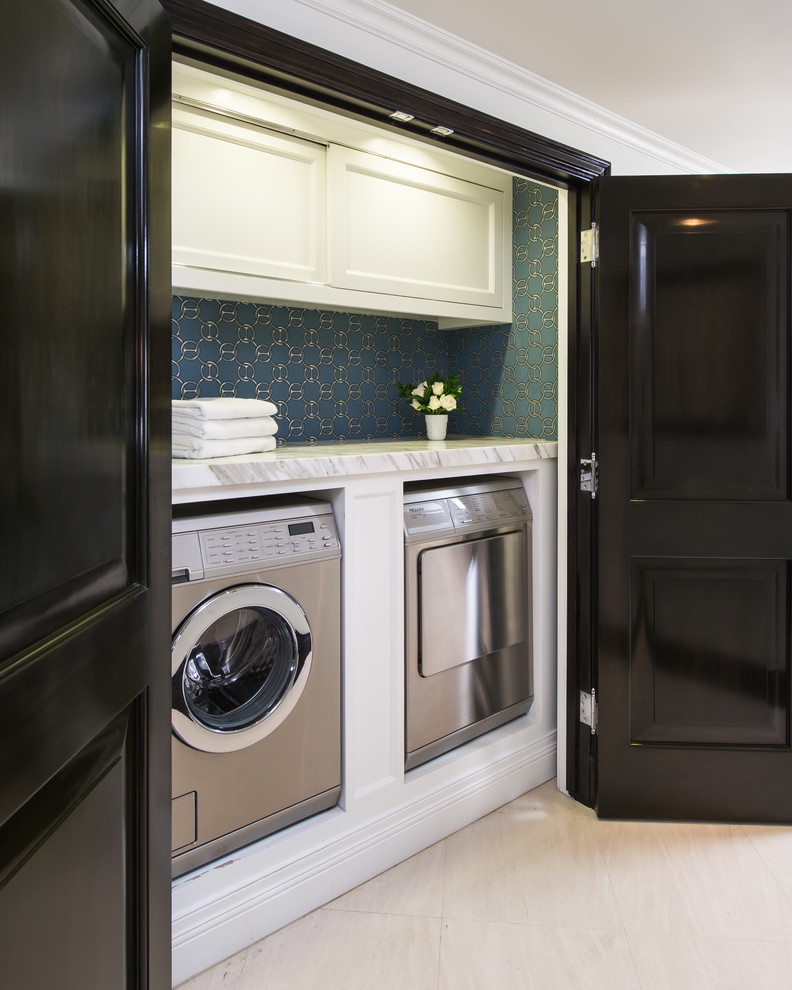 Design ideas for a traditional laundry room in Los Angeles with a side-by-side washer and dryer.