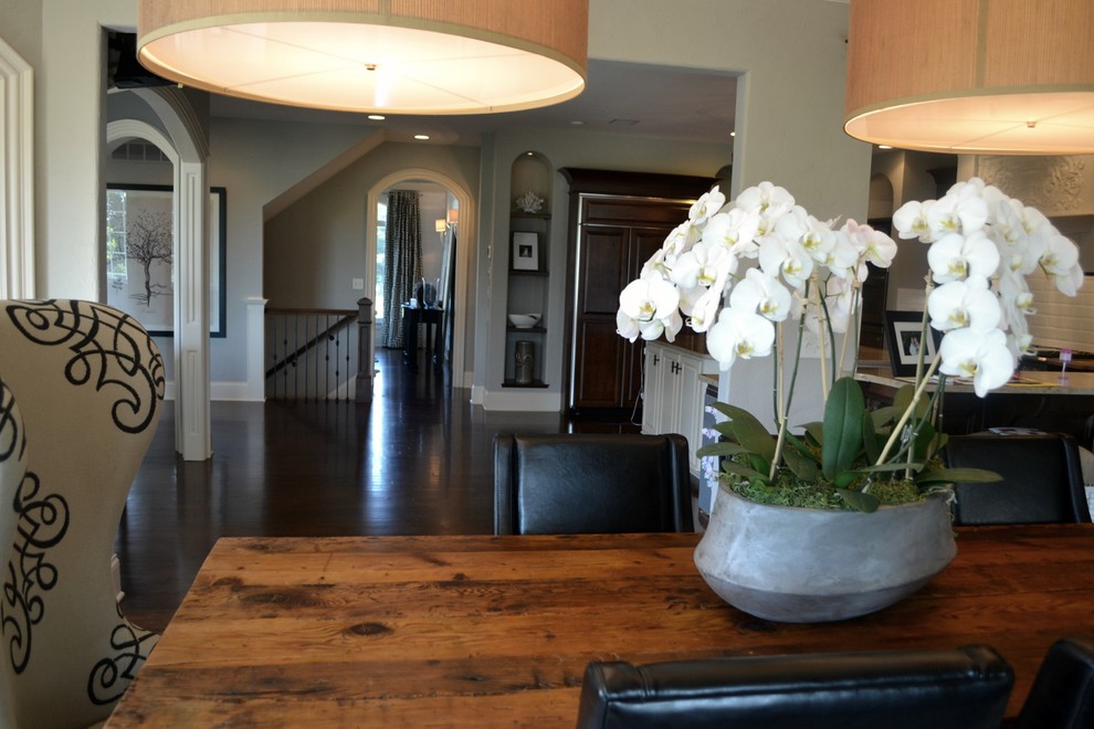 Inspiration for a mid-sized transitional dark wood floor home design remodel in Indianapolis with gray walls, a standard fireplace and a concrete fireplace