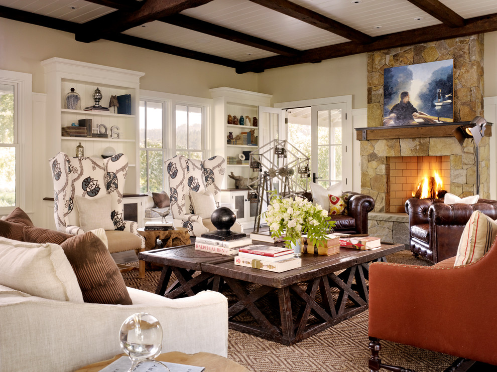 Country living room in San Francisco with a standard fireplace and a stone fireplace surround.