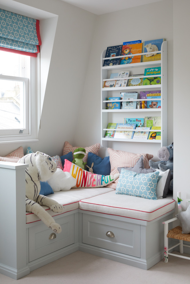 Design ideas for a transitional gender-neutral kids' playroom for kids 4-10 years old in London with white walls.