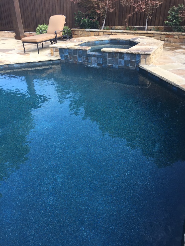 Photo of a mid-sized country pool in Dallas.