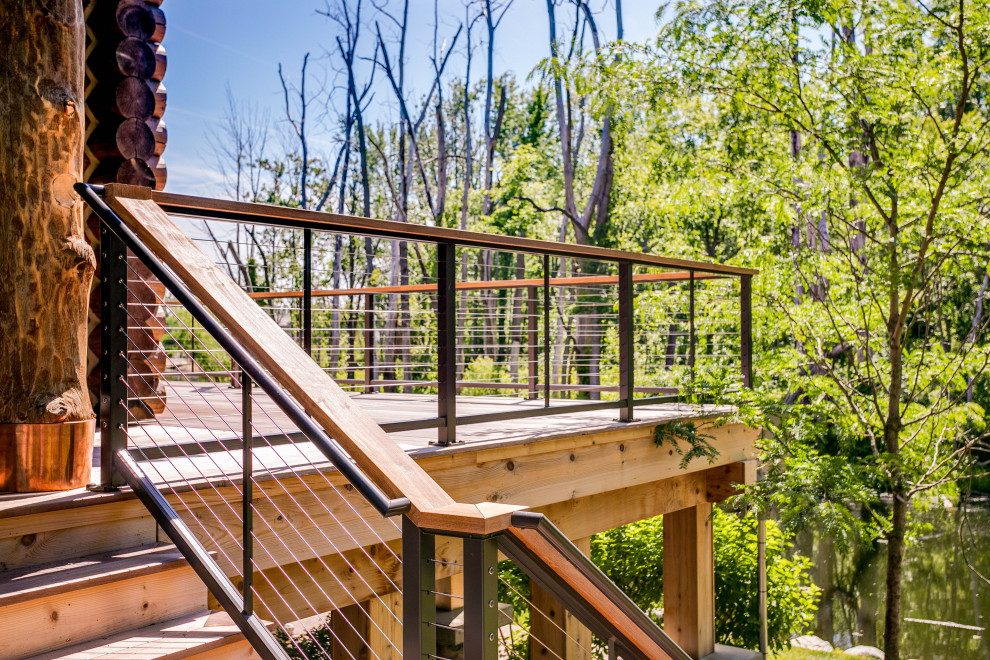 Inspiration for a rustic cable railing deck remodel in Detroit