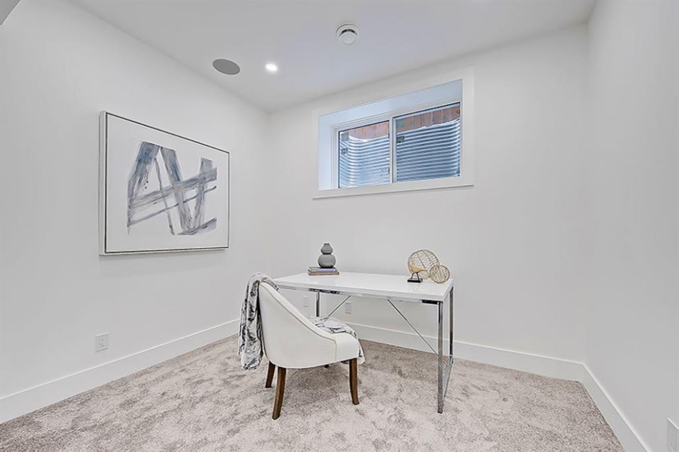 Example of a transitional home design design in Calgary