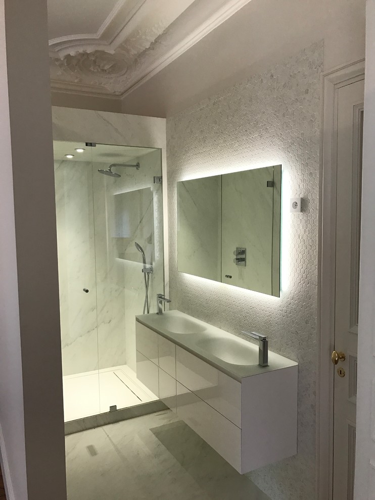 This is an example of a mid-sized contemporary 3/4 bathroom in Paris with beaded inset cabinets, white cabinets, a curbless shower, white tile, ceramic tile, white walls, ceramic floors, a console sink, tile benchtops, white floor and a hinged shower door.