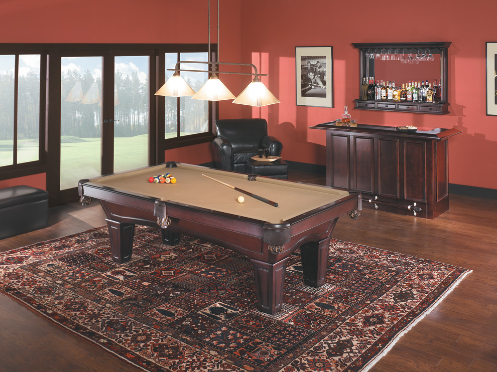 Design ideas for a large transitional enclosed family room in Orange County with a game room, red walls, medium hardwood floors, no fireplace and no tv.