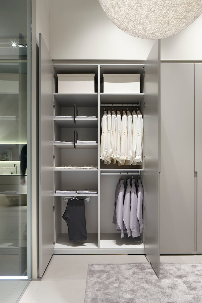 Mid-sized contemporary gender-neutral built-in wardrobe in Other with flat-panel cabinets and grey cabinets.