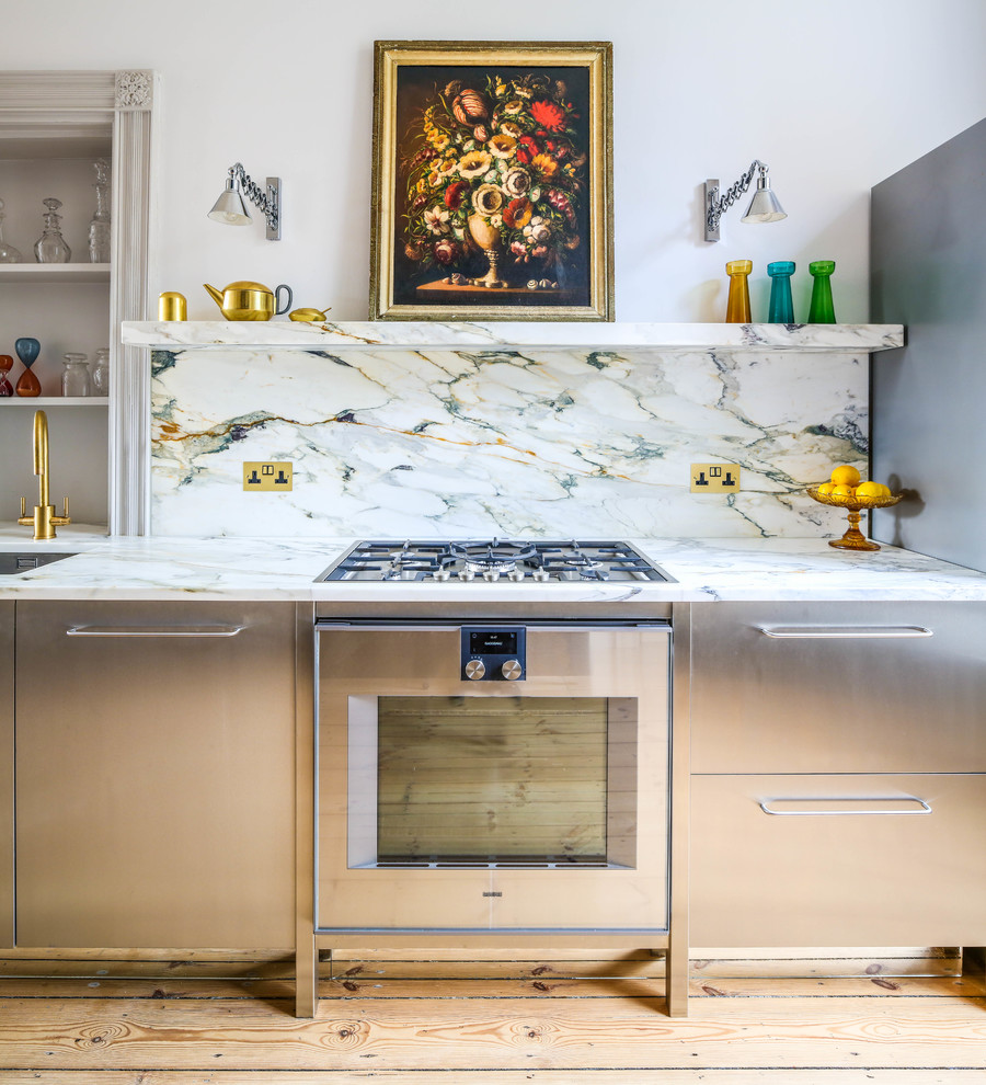 Inspiration for a mid-sized contemporary l-shaped eat-in kitchen in Other with an undermount sink, flat-panel cabinets, stainless steel cabinets, marble benchtops, multi-coloured splashback, marble splashback, stainless steel appliances, light hardwood floors, no island and yellow floor.