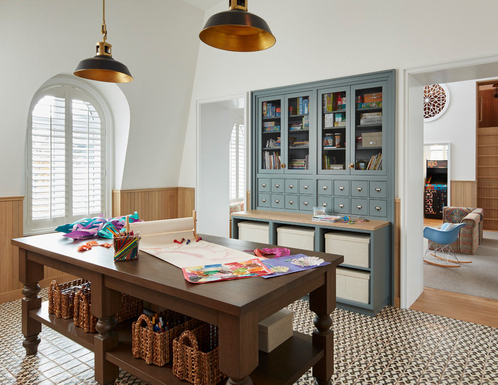 Inspiration for a transitional gender-neutral kids' room in Chicago with white walls and multi-coloured floor.