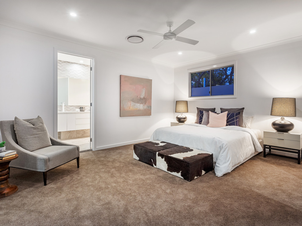 Contemporary master bedroom in Brisbane with white walls, carpet and beige floor.