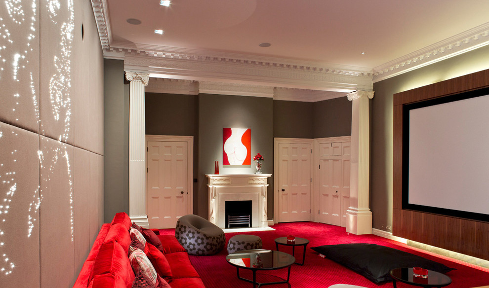 This is an example of a contemporary living room in London with a stone fireplace surround and a built-in media wall.