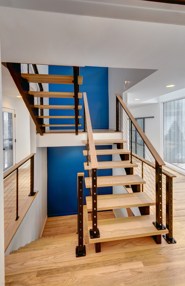 Design ideas for a contemporary wood floating staircase in Detroit with open risers.