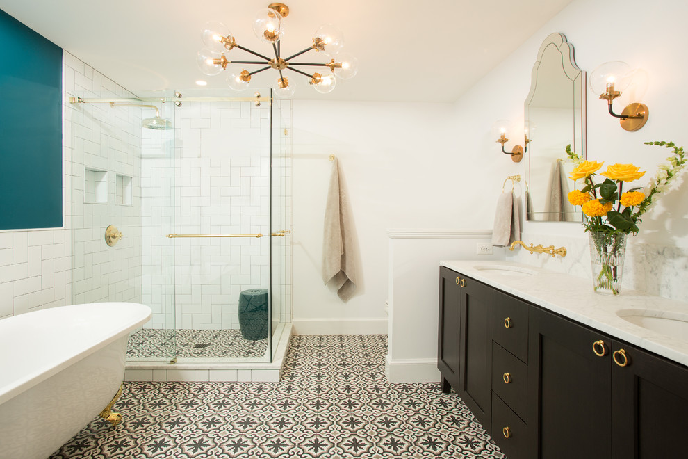 Design ideas for a transitional master bathroom in DC Metro with shaker cabinets, black cabinets, a freestanding tub, a corner shower, white tile, white walls, cement tiles, an undermount sink, multi-coloured floor, a sliding shower screen and white benchtops.