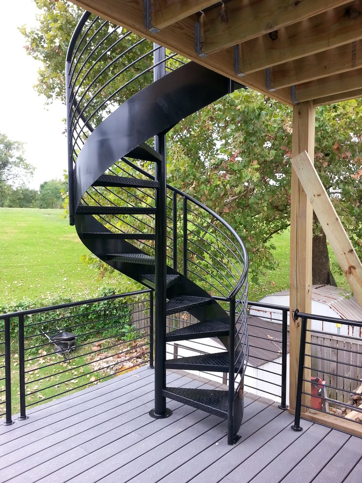 Inspiration for a modern metal spiral staircase in Charleston with open risers and metal railing.
