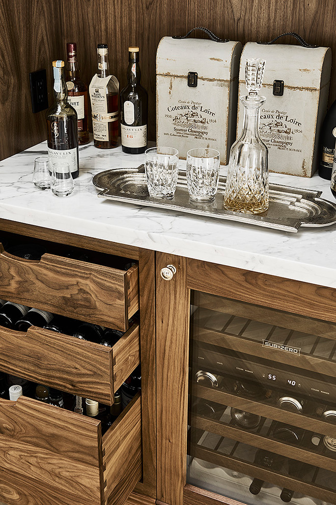 Inspiration for a small traditional single-wall wet bar in Vancouver with shaker cabinets, dark wood cabinets, marble benchtops, brown splashback and timber splashback.