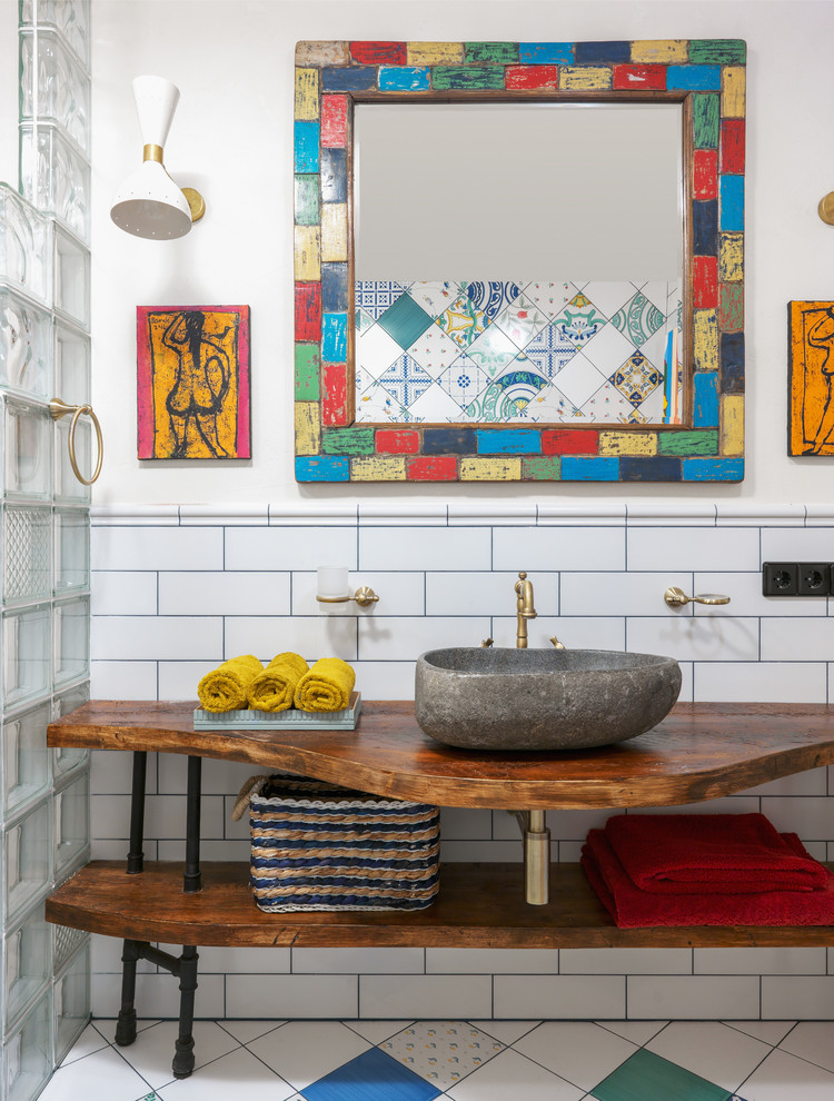 This is an example of an eclectic bathroom in Moscow with open cabinets, white tile, white walls, a vessel sink and multi-coloured floor.