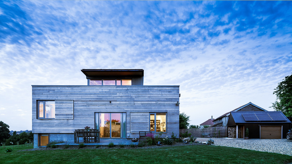This is an example of a contemporary one-storey exterior in London with wood siding.