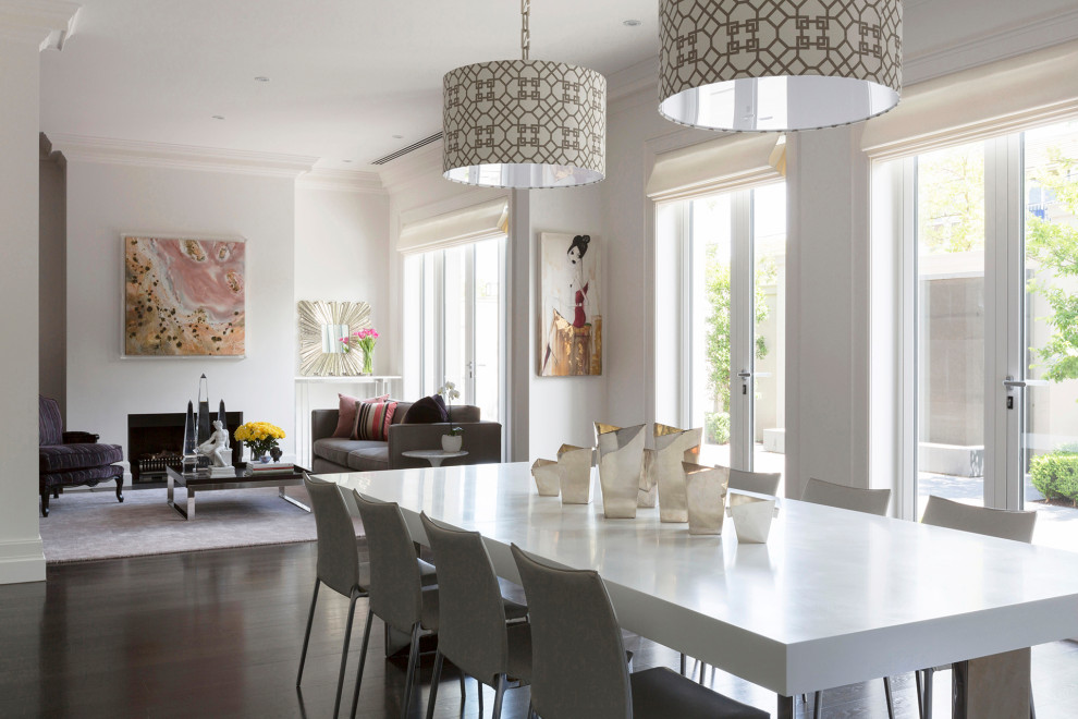 Design ideas for a large contemporary dining room in Melbourne with white walls, painted wood floors and brown floor.
