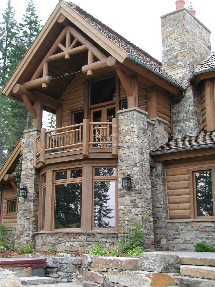 This is an example of a country two-storey exterior in Other with mixed siding.