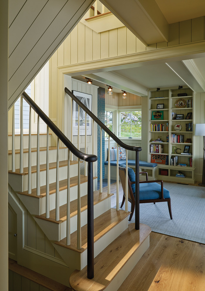 Beach style staircase in Portland Maine with wood risers and wood railing.