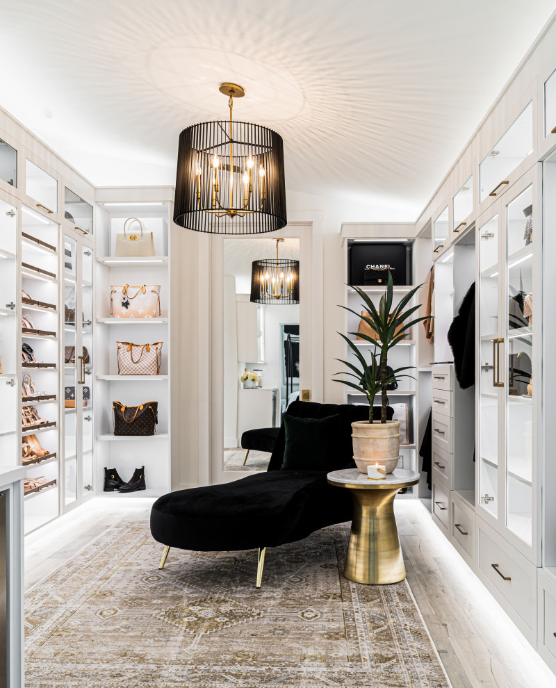 Inspiration for a large transitional women's walk-in closet remodel in Other with recessed-panel cabinets and white cabinets