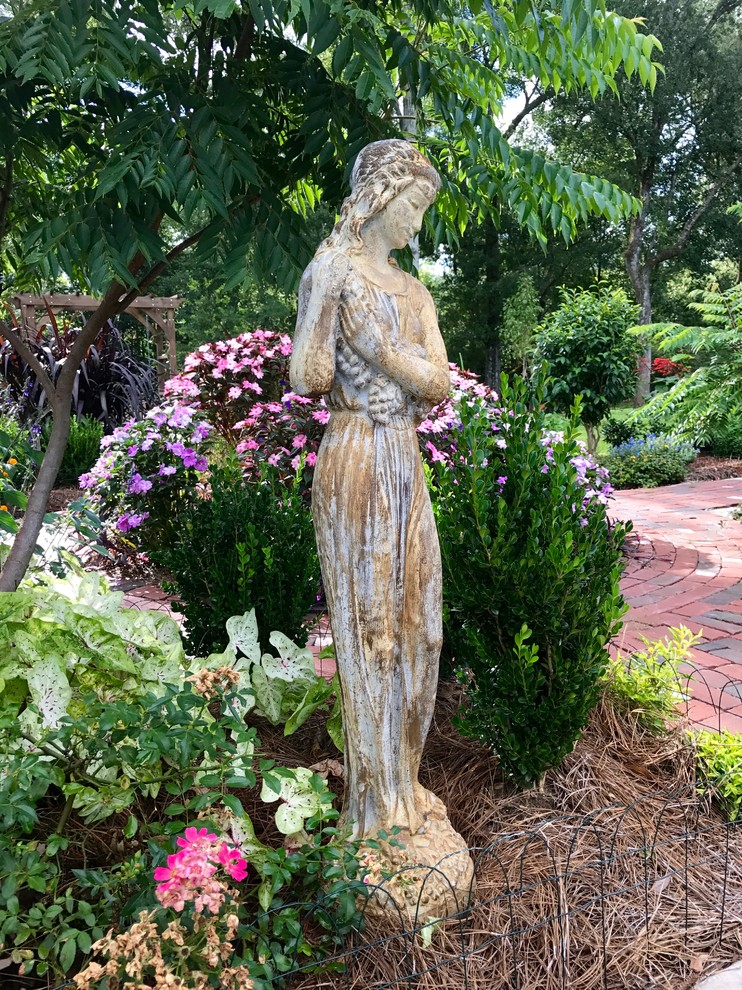 Design ideas for a large rustic partial sun courtyard brick formal garden in New Orleans for summer.