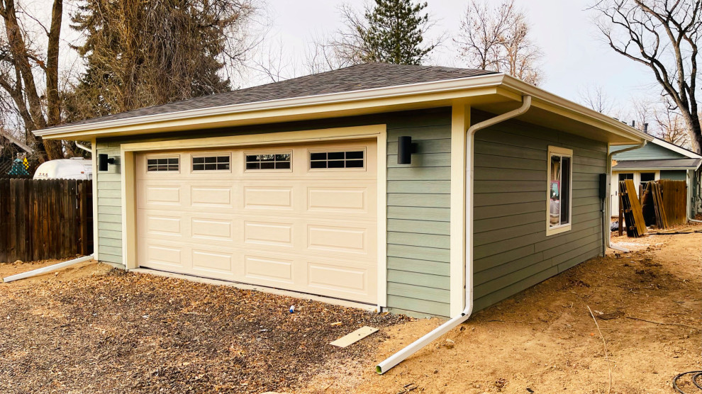 Photo of a mid-sized contemporary detached two-car garage in Denver.