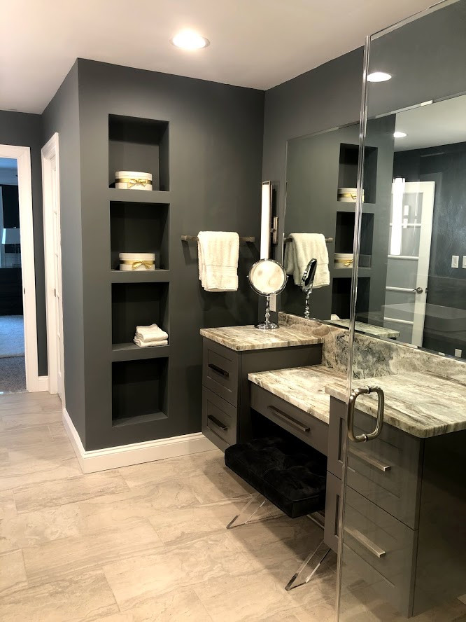 Inspiration for a mid-sized transitional master gray tile and porcelain tile porcelain tile, gray floor and double-sink bathroom remodel in Baltimore with shaker cabinets, gray cabinets, a one-piece toilet, blue walls, a vessel sink, granite countertops, a hinged shower door and a floating vanity