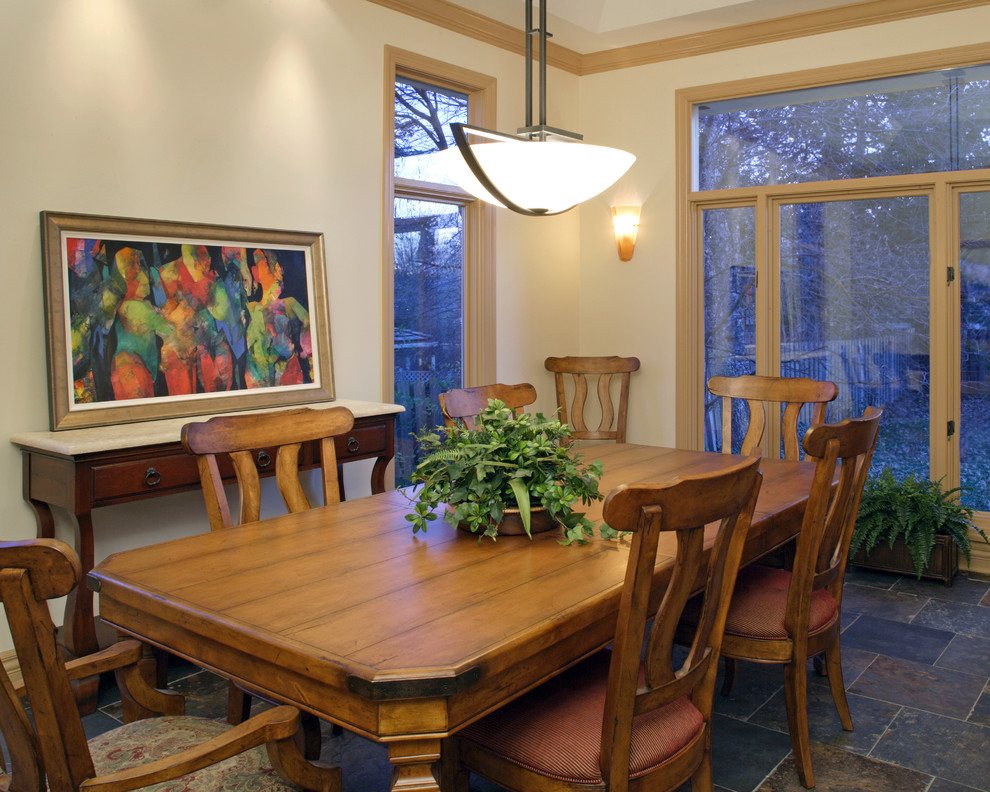 Mid-sized contemporary separate dining room in Omaha with white walls, slate floors, no fireplace and grey floor.