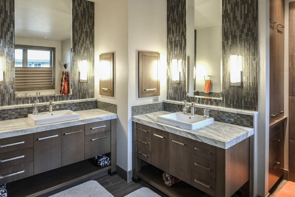 Design ideas for a mid-sized contemporary master bathroom in Other with flat-panel cabinets, medium wood cabinets, gray tile, ceramic tile, white walls, ceramic floors, a drop-in sink and marble benchtops.