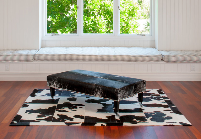 Cowhide Ottoman With Casters And Studs Contemporary Living