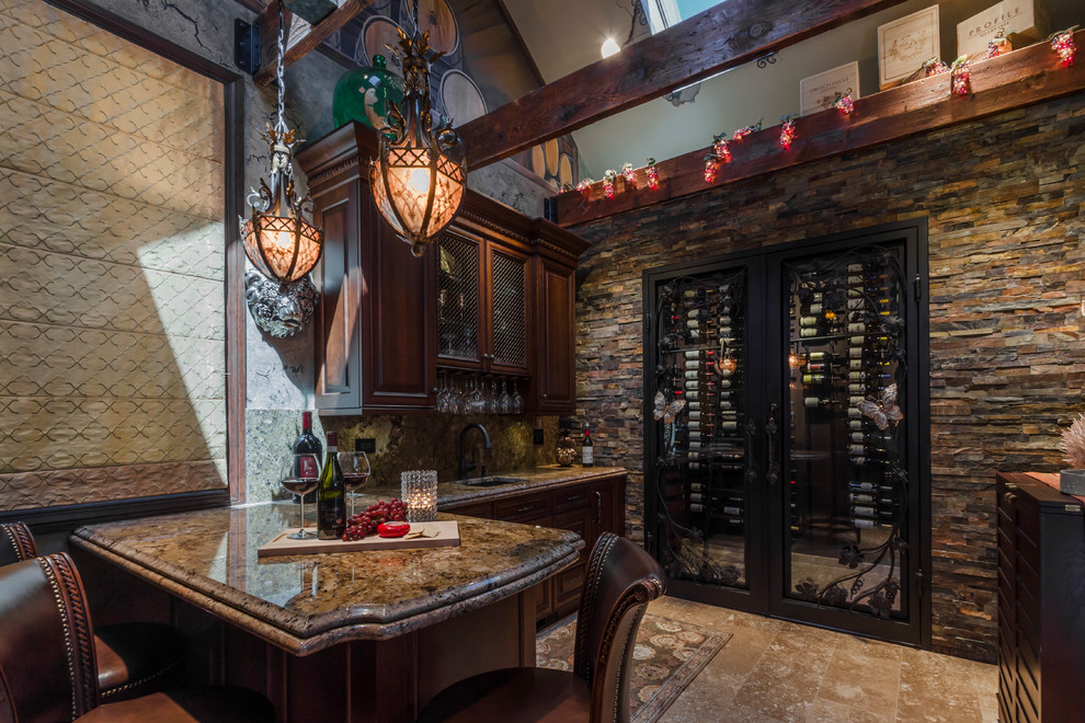 Photo of a large mediterranean wine cellar in Chicago with travertine floors and display racks.