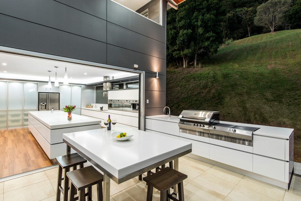 Contemporary kitchen in Brisbane with flat-panel cabinets.