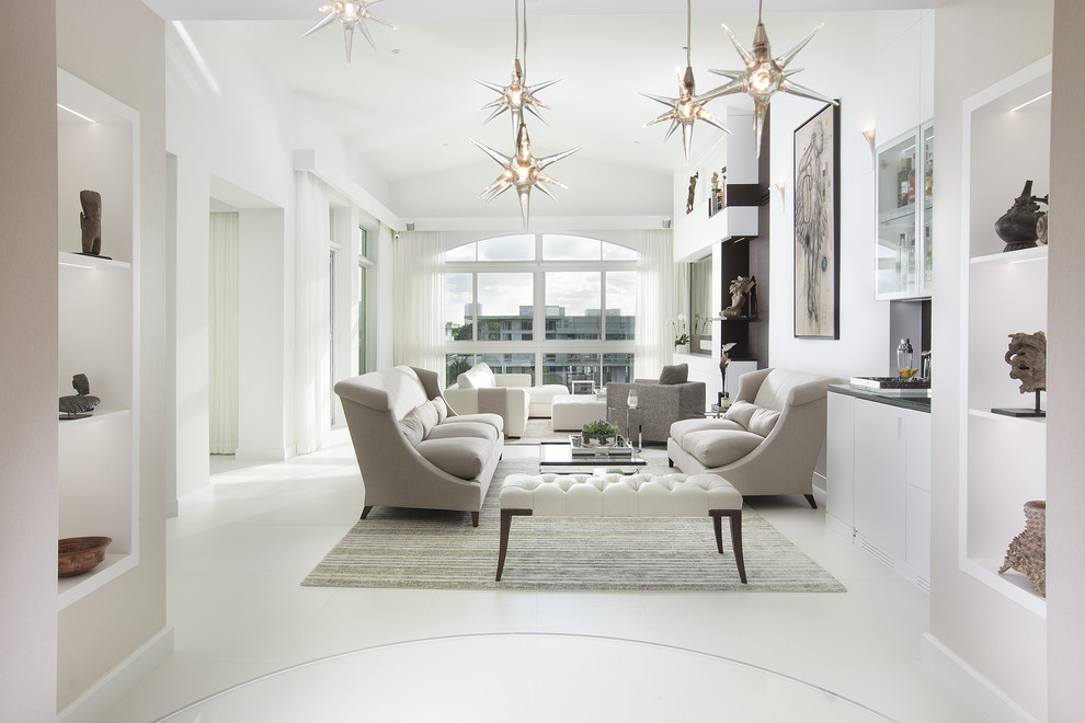 This is an example of a transitional living room in Miami with white walls.