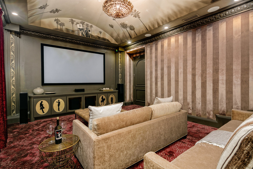 Inspiration for a traditional enclosed home theatre in Los Angeles with beige walls, carpet and red floor.