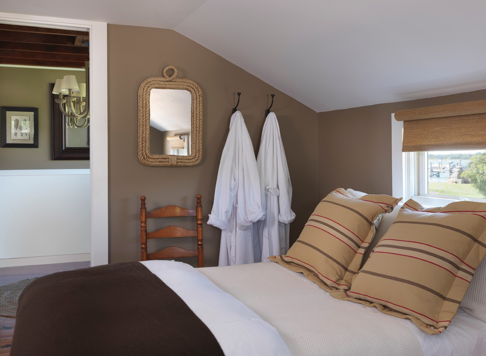 Beach style bedroom in Providence with brown walls.