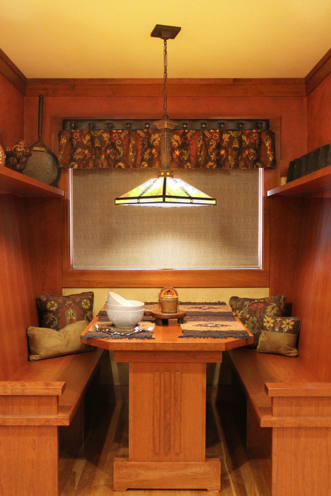 Example of a huge mountain style light wood floor eat-in kitchen design
