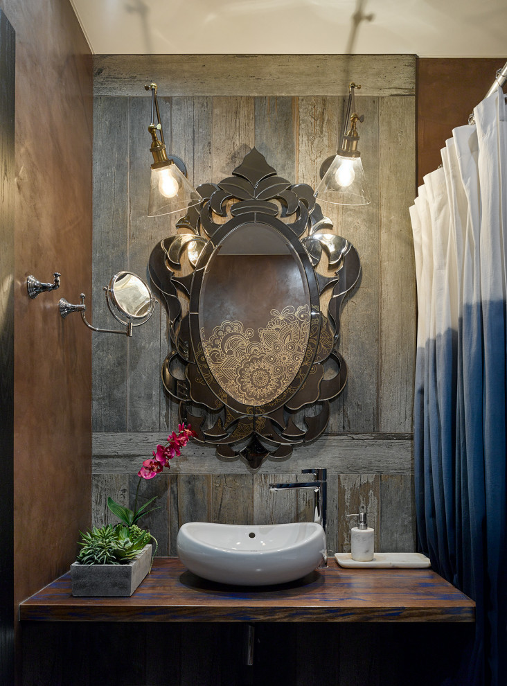 Photo of an eclectic powder room in Moscow with wood walls.