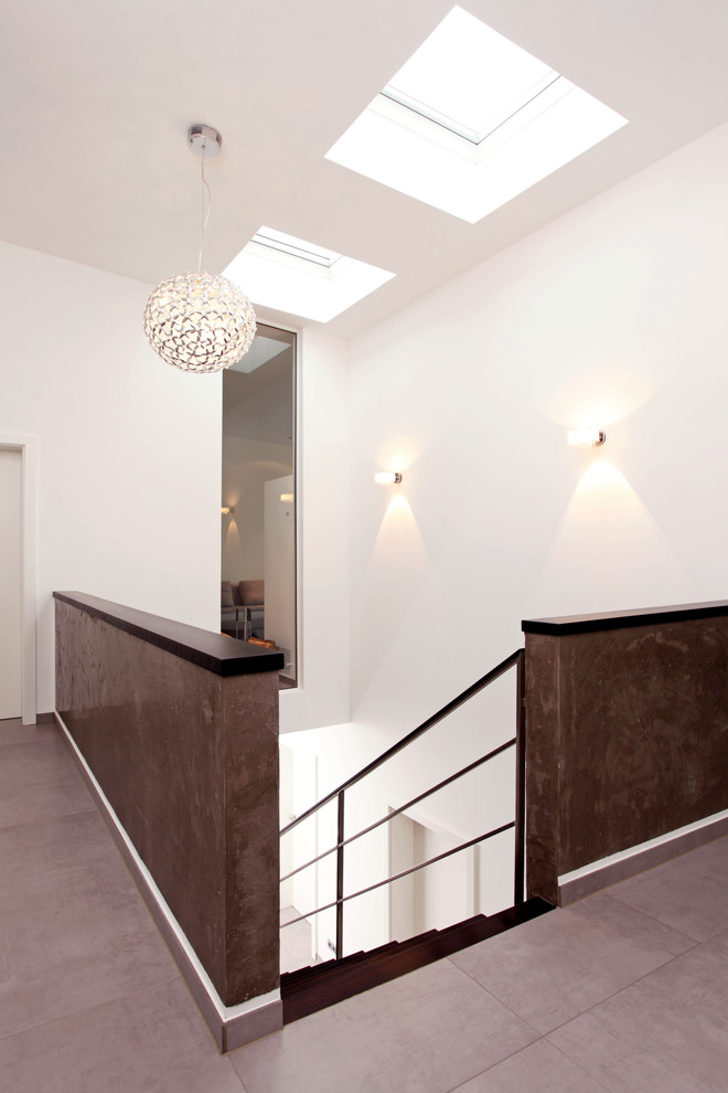Inspiration for an expansive contemporary hallway in Dortmund with white walls.