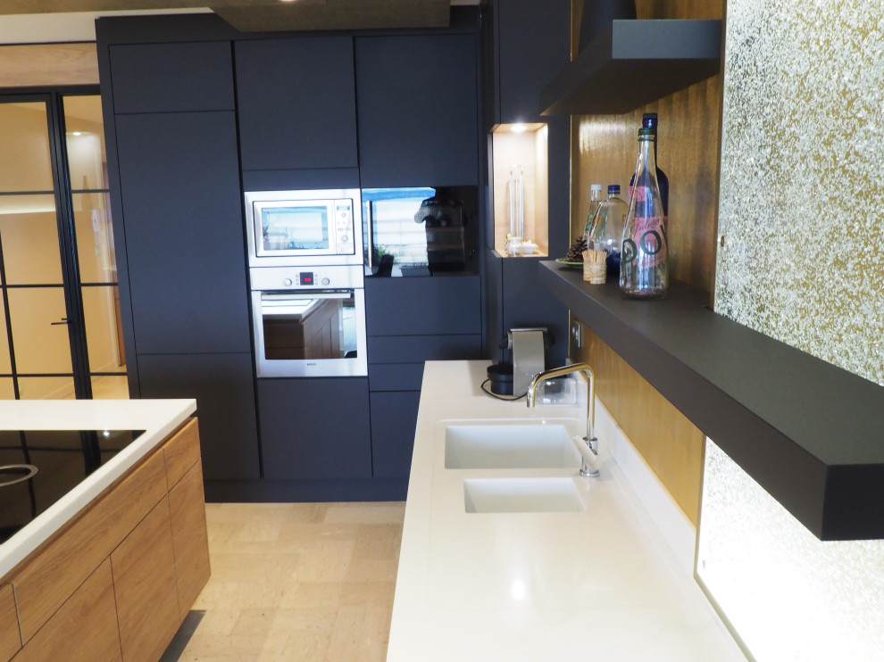 Large transitional l-shaped eat-in kitchen in Other with an integrated sink, flat-panel cabinets, grey cabinets, solid surface benchtops, yellow splashback, stainless steel appliances, travertine floors, with island, beige floor, white benchtop and recessed.